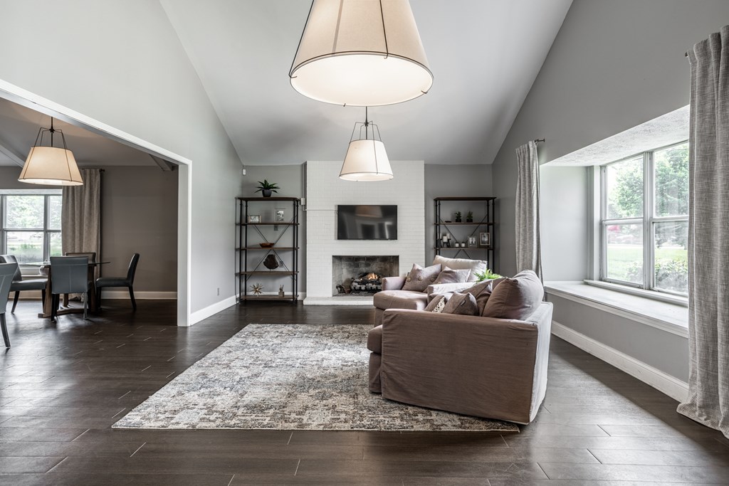 A living room with a fireplace and a couch