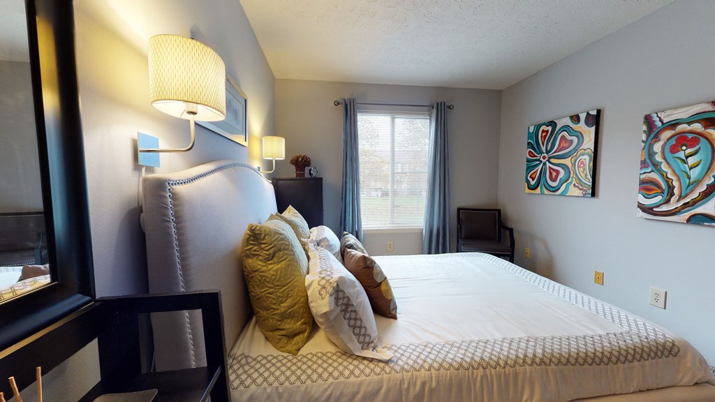 Bedroom area with bed at The Timbers Apartments, Evansville