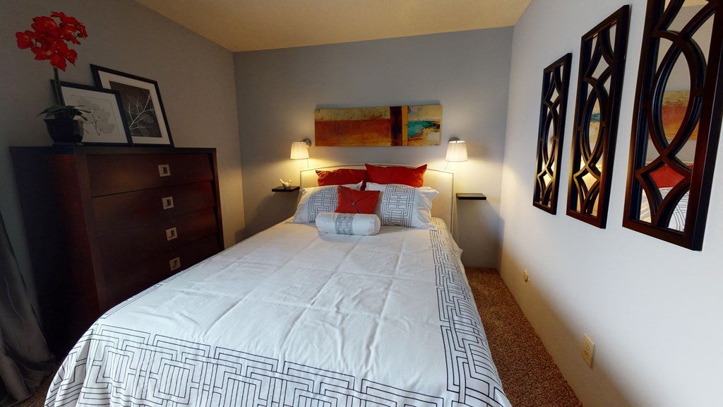 Bedroom with window and lights at The Timbers Apartments, Evansville