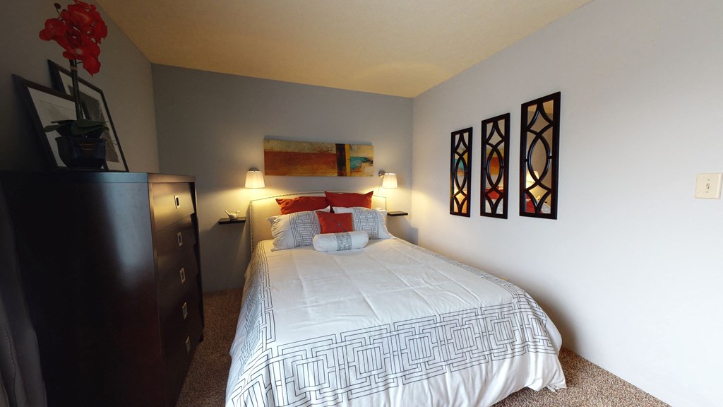 Bedroom with window and lights decor at The Timbers Apartments, Indiana