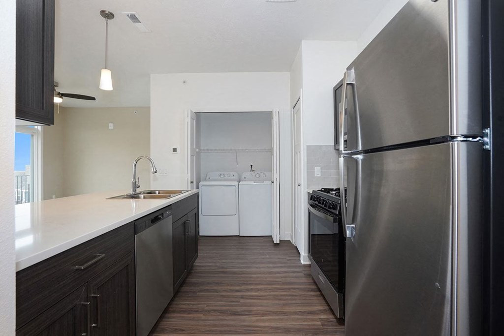 Kitchen with Washer & Dryer at Meadowbrooke Apartment Homes in Kentwood, MI 49512