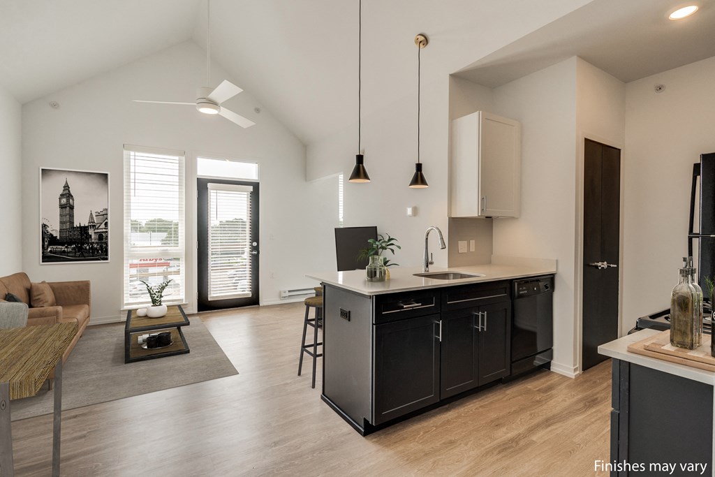 a kitchen and living room in a 555 waverly unit  at Uptown Square Apartments, Troy, MI, 48083