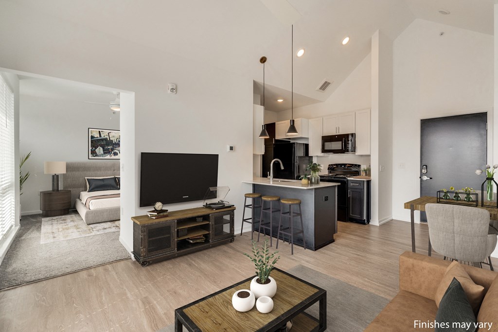 a view of the living room and kitchen from the dining area  at Uptown Square Apartments, Troy, MI