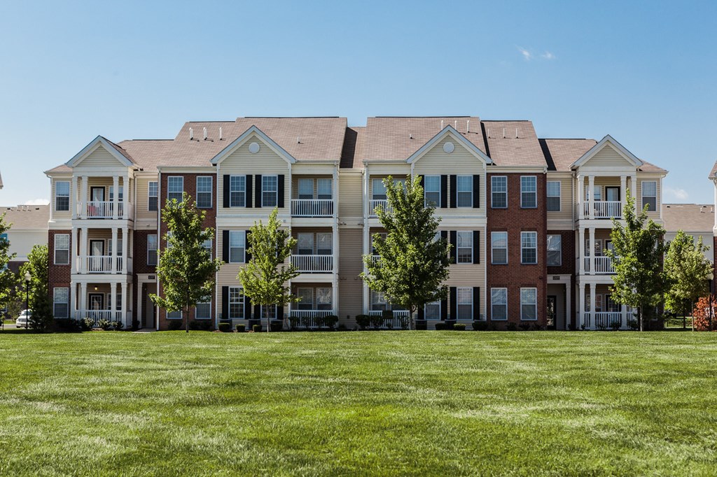 an image of an apartment building on a green lawn at Brickshire Apartments, Merrillville, Indiana