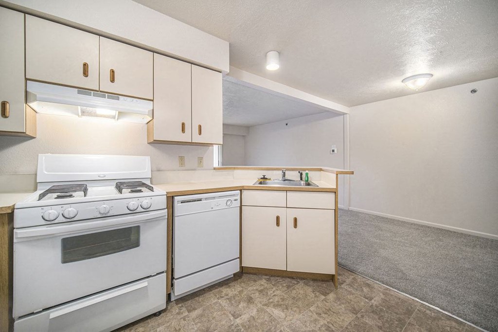 a kitchen with breakfast bar at Canal 2 Apartments, Lansing, 48917