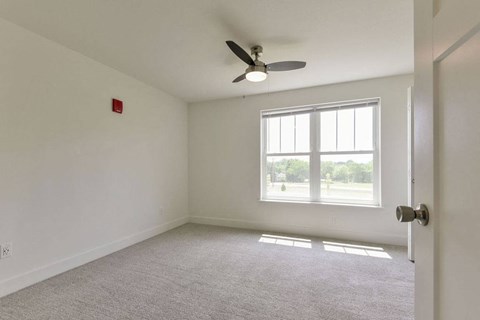 Bedroom with a Ceiling Fan at Chase Creek Apartment Homes, Huntsville, AL, 35811