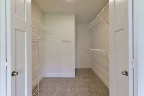 a walk in closet in a home at Chase Creek Apartment Homes, Huntsville