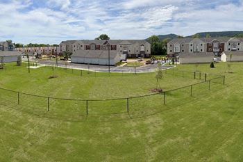 an aerial view of a fenced in dog park at Chase Creek Apartment Homes in Alabama