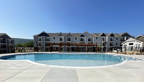 Relaxing Pool with Lounge Chairs at Chase Creek Apartment Homes, Alabama