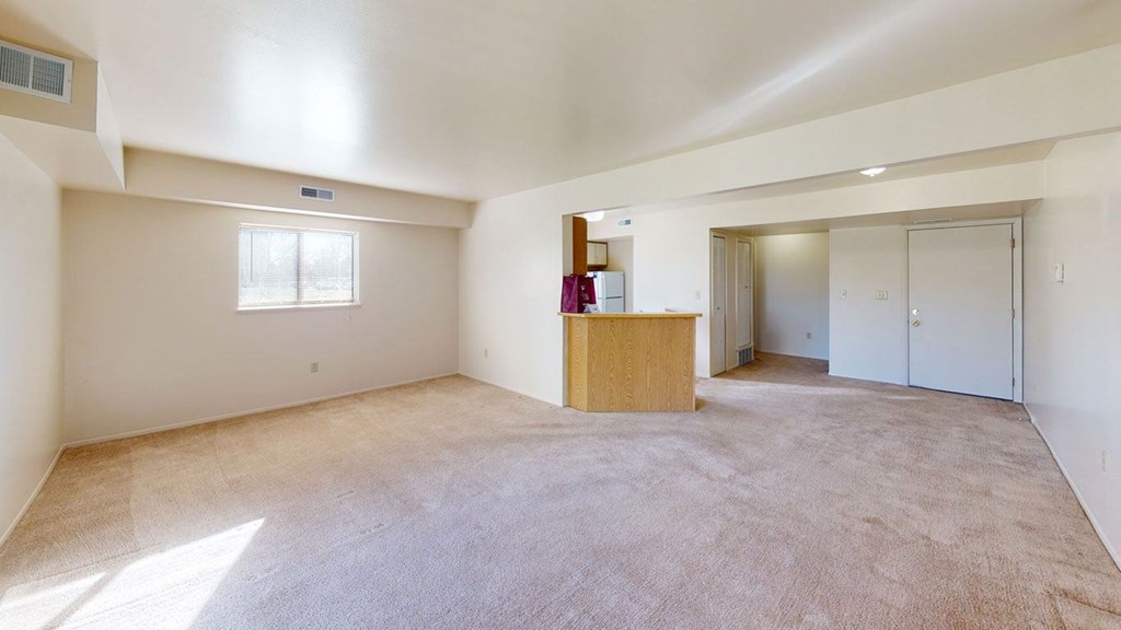 enlarged living room with extra window at Canal Club Apartments, Lansing, 48917