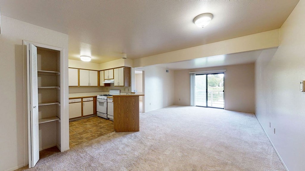 Two bedroom one bath living room and kitchen at Canal Club Apartments, Michigan, 48917