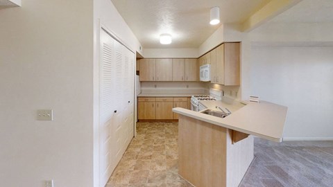 a kitchen with wooden cabinets and white appliances