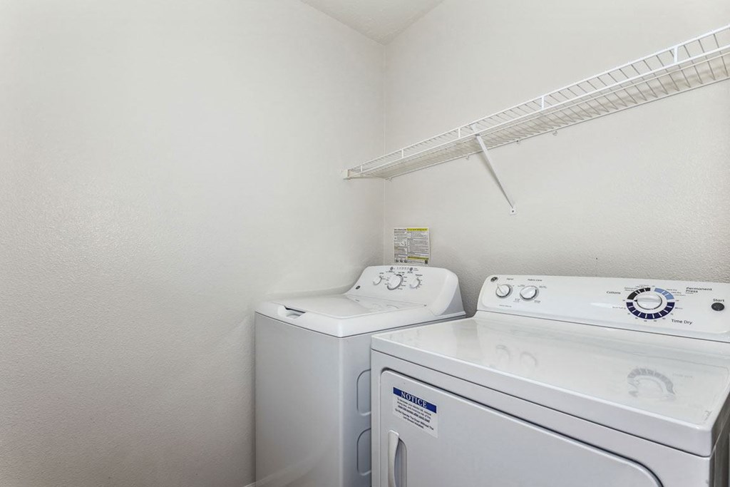 Laundry room with washer and a dryer at Colonial Pointe at Fairview Apartments, Bellevue, NE, 68123