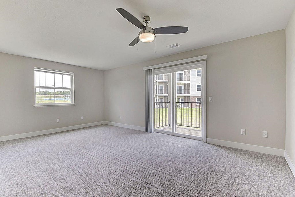 Enlarged living room with extra window at Copper Creek Apartment Homes, Maize, Kansas