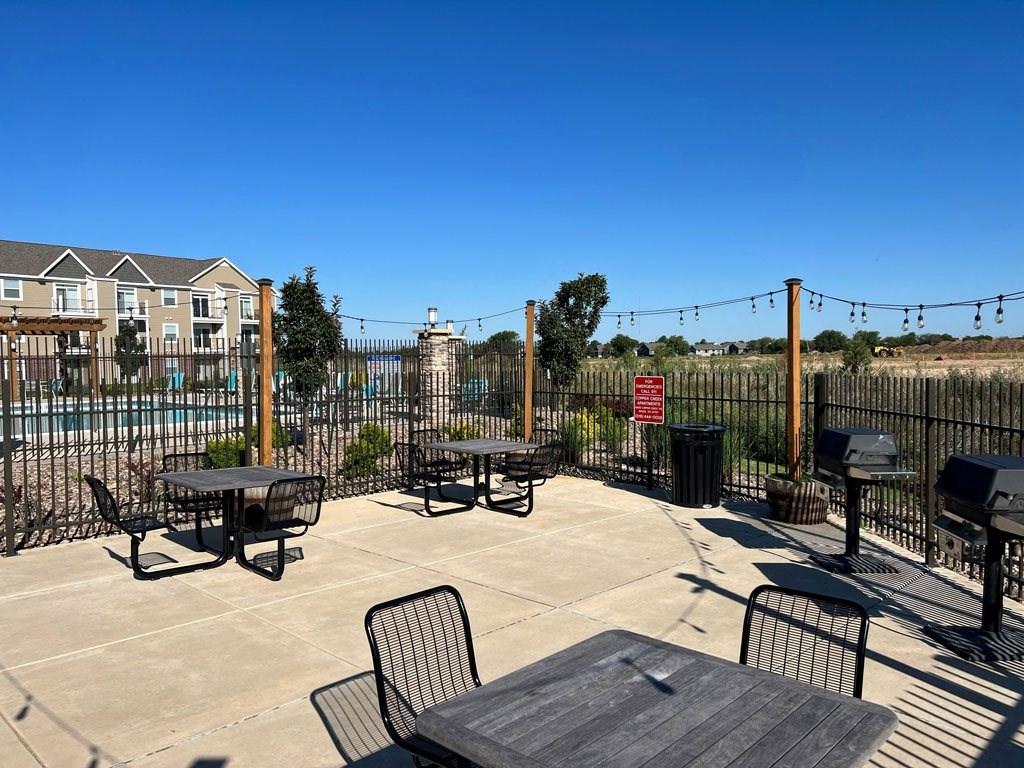 Grilling Area with Seating at Copper Creek Apartment Homes in Maize, Kansas