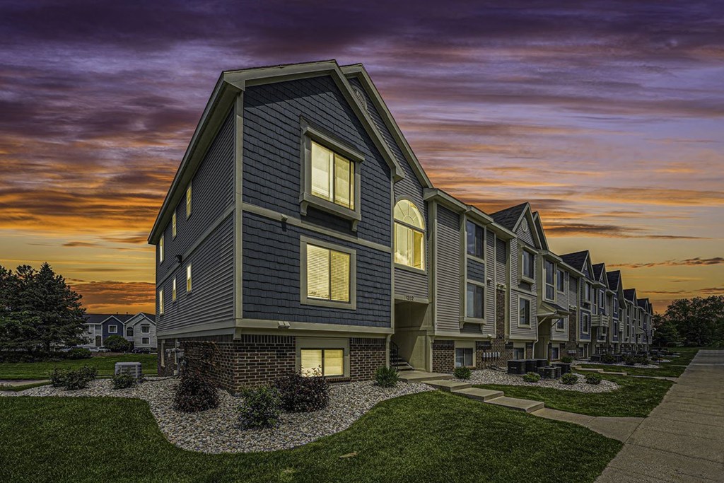 sunset view of apartment building at The Crossings Apartments, Michigan, 49508