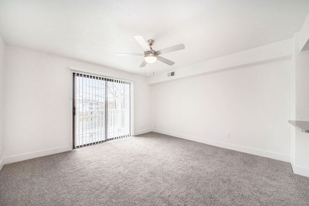 Renovated Living Room with Ceiling Fan at The Crossings Apartments, Grand Rapids, Michigan
