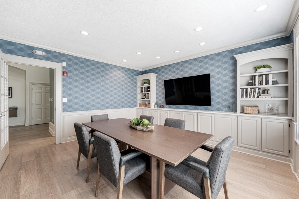 a dining room with a table and chairs at Latitudes Apartments, Indianapolis