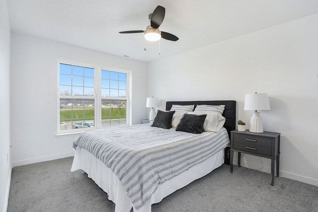 Bedroom With Expansive Windows at Meadowbrooke Apartment Homes, Grand Rapids