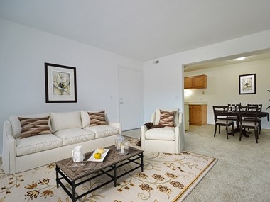 Living Room With Dining Area at Charter Oaks Apartments, Davison, Michigan