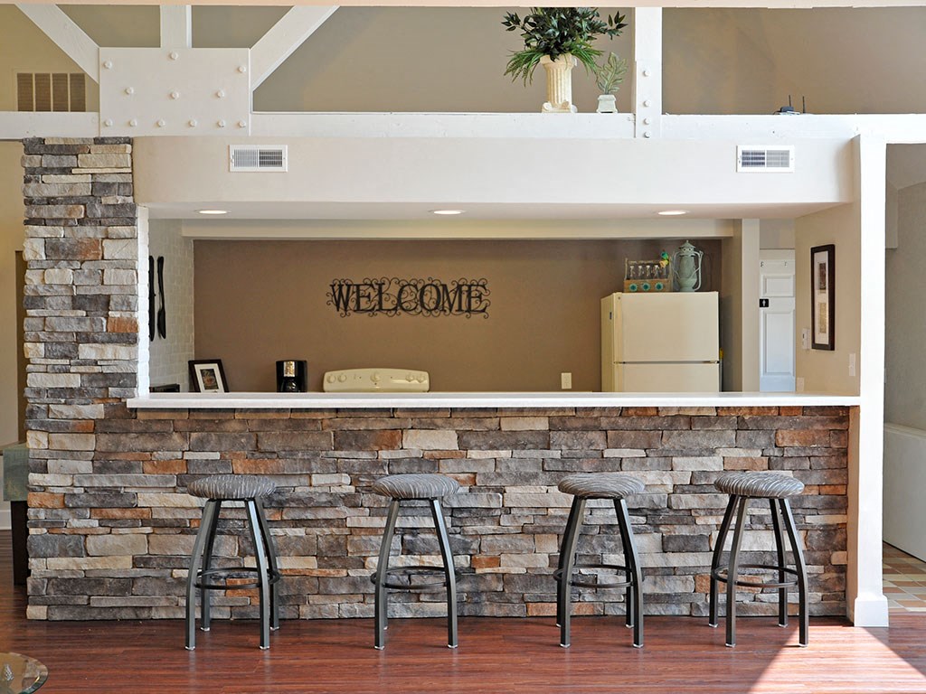 Clubhouse Kitchen with Breakfast Bar Seating at Charter Oaks Apartments, Davison, MI