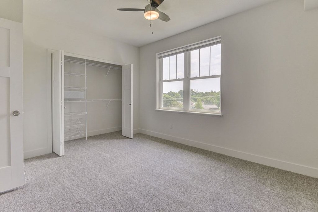 Bright Bedroom With Walk-In Closet at Dodson Pointe Apartment Homes, Rogers, AR