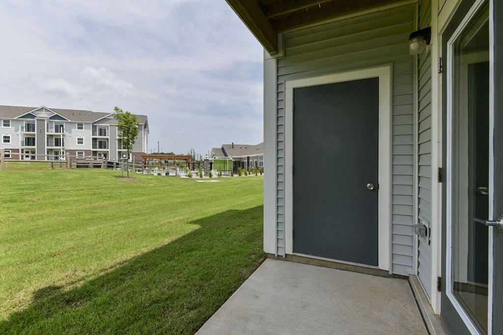 Lush, Green Pond Views from Private Patio at Dodson Pointe Apartment Homes, Rogers, AR, 72758