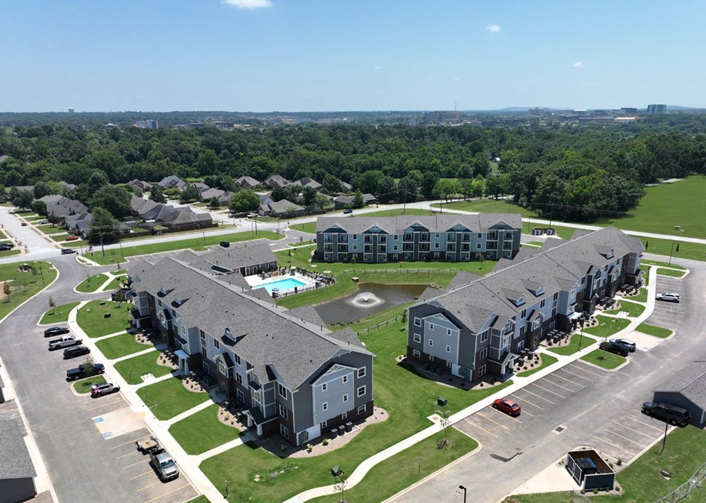 an aerial view of an apartment complex and parking lot at Dodson Pointe Apartment Homes, Rogers