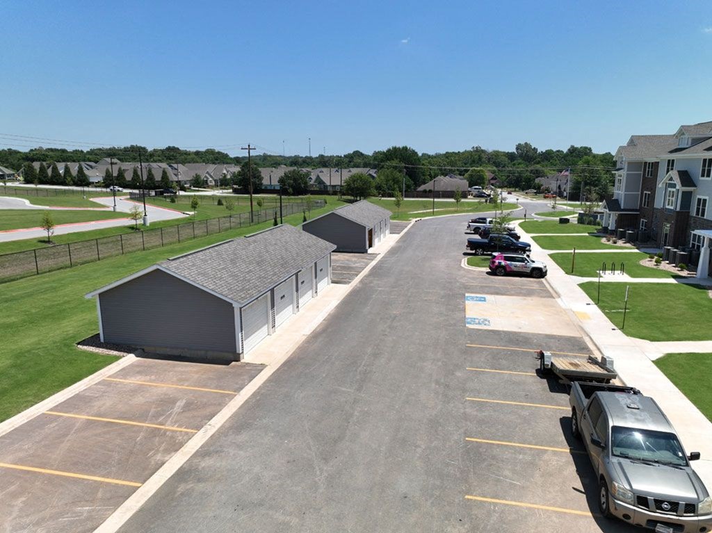 Aerial View of Parking Lot with Garages at Dodson Pointe Apartment Homes, Rogers, AR