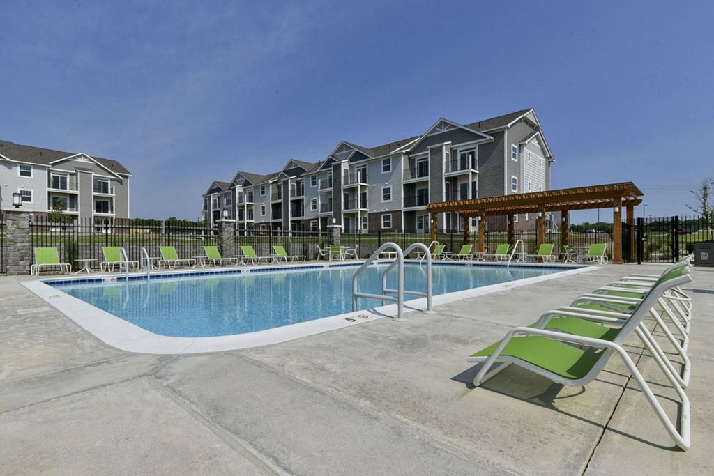 Pool with W-F- and Chaise Lounge Chairs at Dodson Pointe Apartment Homes, Rogers, AR