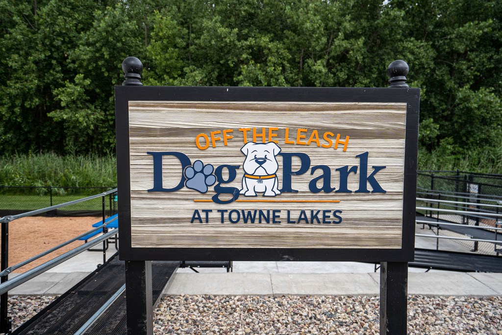A sign for Off the Leash Dog Park at Towne Lakes.