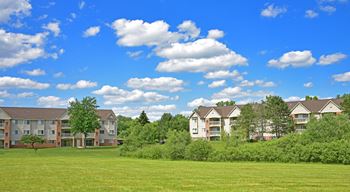 an open field in front of some apartment buildings  Windsor Place, Michigan, 484