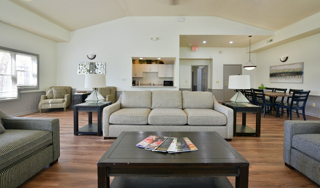 a living room with a couch and a coffee table at Heatherwood Apartments, Grand Blanc