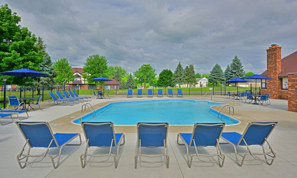 our apartments have a large pool with chairs and umbrellas