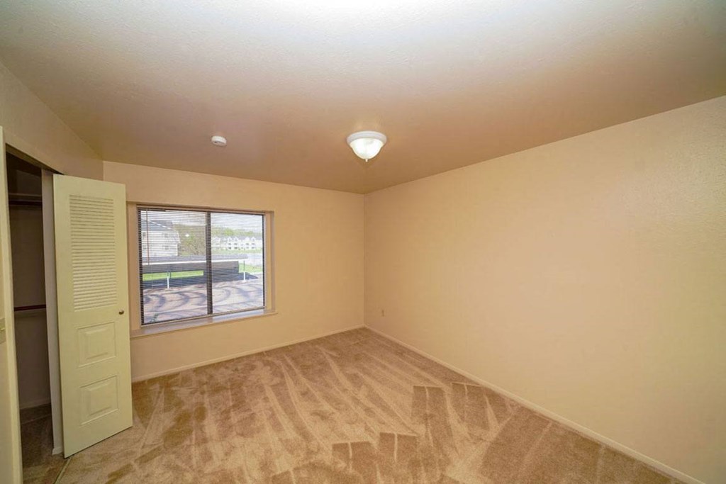 Spacious bedroom with a large window