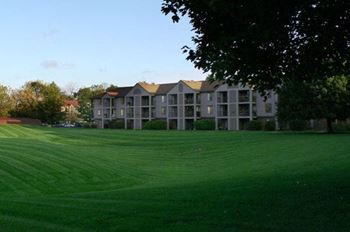 Open Lawns with Mature Shade Trees at Emerald Park Apartments in Kalamazoo, MI