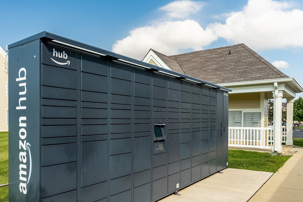 A large Amazon Hub building is situated in front of a house