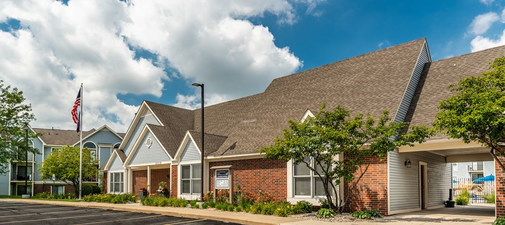 A row of houses with a flag on the left