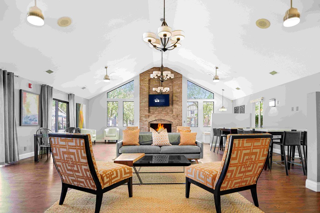 a living room with a couch and chairs and a fireplace at Bay Pointe Apartments, Lafayette, IN, 47909