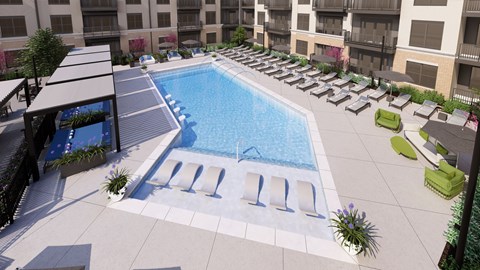 A large swimming pool surrounded by lounge chairs and umbrellas.