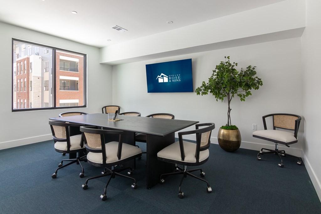 a conference room with a large table and chairs
