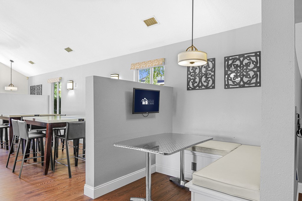 a kitchen with a bar and a dining area at Pheasant Run Apartments, Indiana