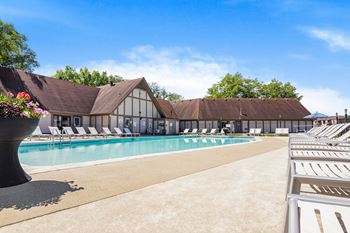 Swimming pool with a white building with a brown roof in the background  at Pheasant Run, Lafayette
