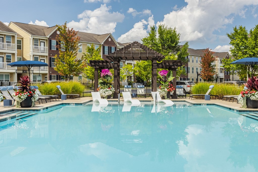 our apartments offer a swimming pool with a gazebo and umbrellas at The Avenue at Polaris Apartments, Columbus, OH