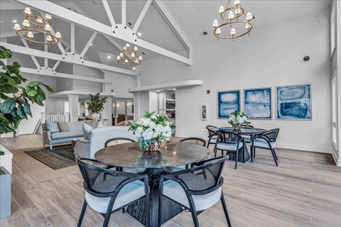 a dining room with a table and chairs at The Vinings Apartments in Richmond, VA