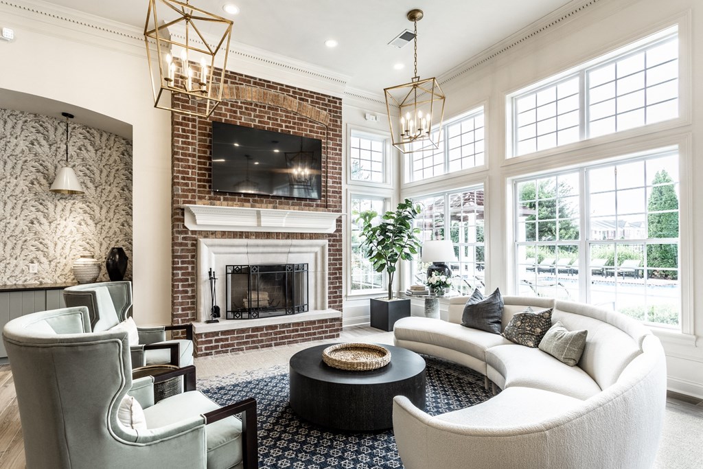 a couch and fireplace in the clubhouse  at Alexandria of Carmel Apartments, Carmel
