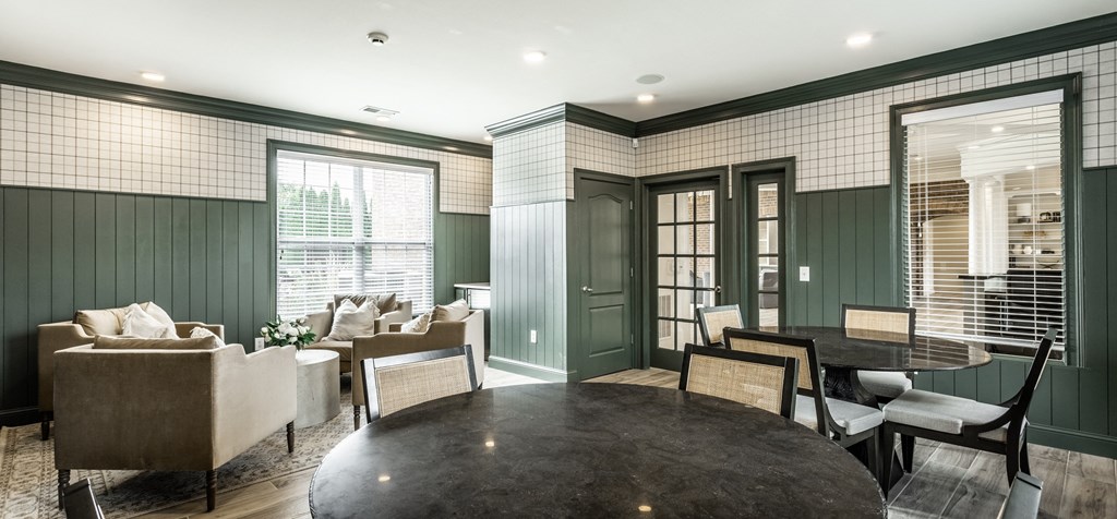 Tables and chairs in leasing center at Alexandria of Carmel Apartments, Carmel, Indiana