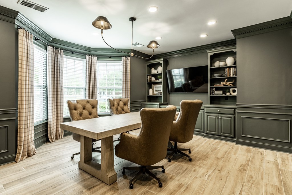 Clubhouse business center with conference table at Alexandria of Carmel Apartments, Indiana