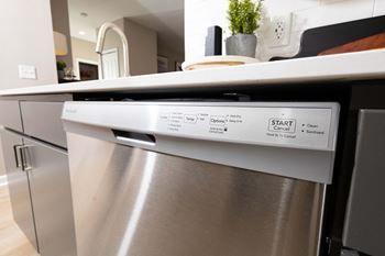 a dishwasher in a kitchen with a counter top  at Alexandria of Carmel Apartments, Indiana