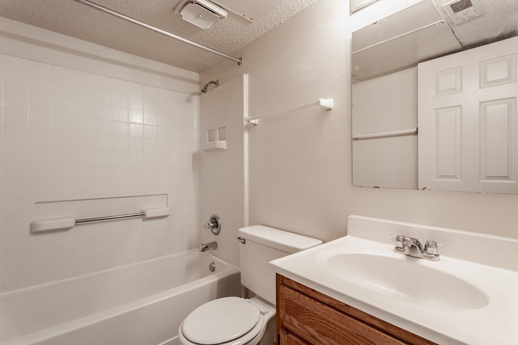 a bathroom with a sink toilet and bathtub at Bavarian Village Apartments, Indianapolis, IN